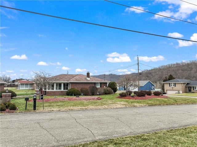 ranch-style home with a front yard