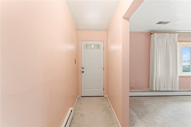 doorway featuring a baseboard radiator and light colored carpet