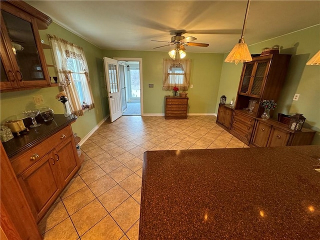 kitchen with light tile patterned flooring and ceiling fan