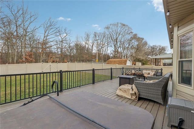 wooden deck featuring a yard