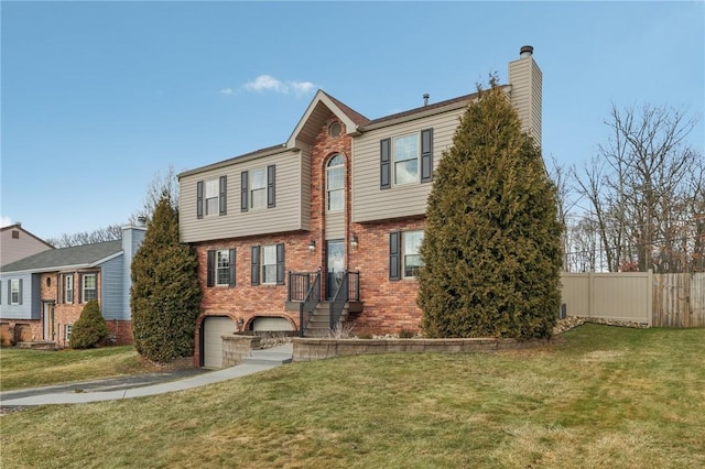 view of front of home featuring a garage and a front lawn