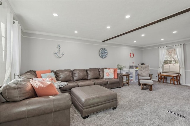 carpeted living room with crown molding