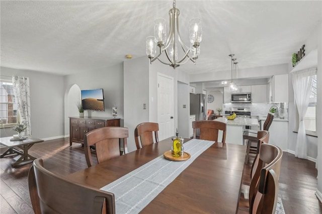 dining room featuring dark hardwood / wood-style floors and a wealth of natural light