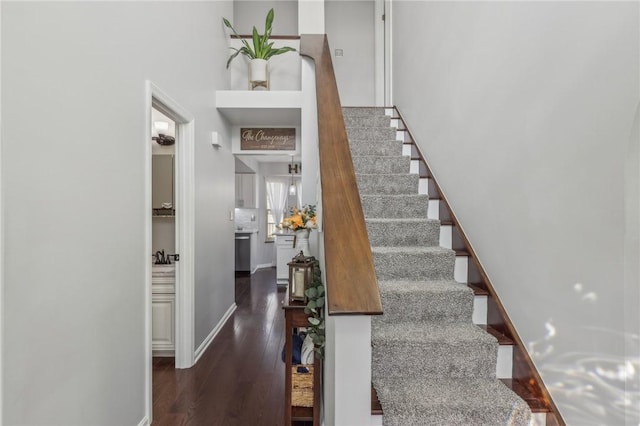 stairs featuring wood-type flooring