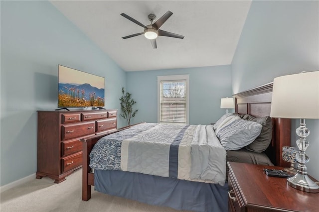 bedroom featuring lofted ceiling, light carpet, and ceiling fan