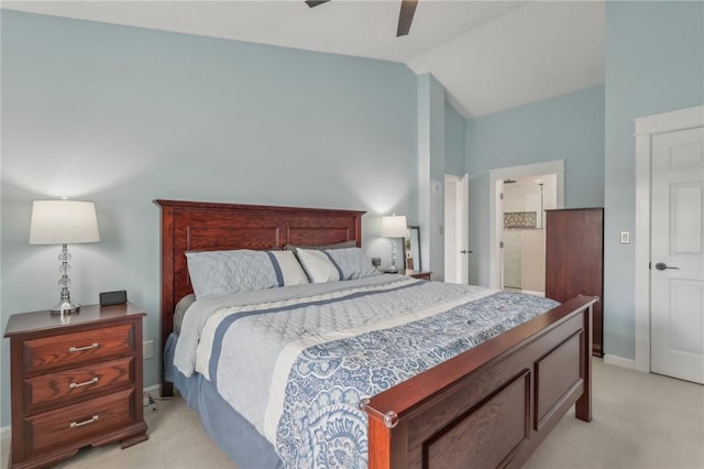 bedroom featuring lofted ceiling, light colored carpet, and ceiling fan