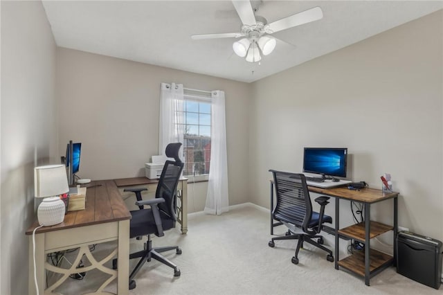 office featuring light carpet and ceiling fan