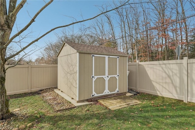 view of outbuilding featuring a yard