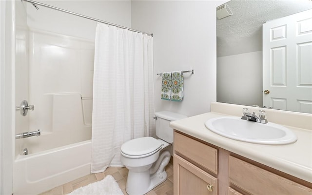 full bathroom with shower / tub combo with curtain, vanity, a textured ceiling, tile patterned floors, and toilet