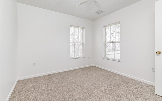 empty room with light carpet and ceiling fan