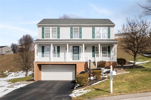 view of front of house featuring a garage and a front yard