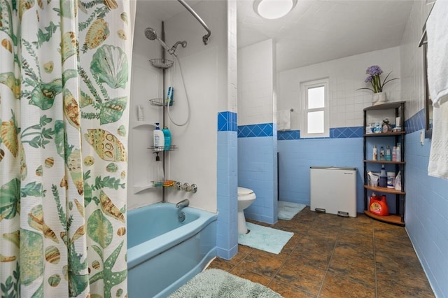 bathroom with tile walls, toilet, and shower / tub combo