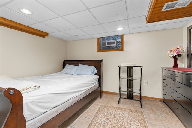 bedroom with visible vents, a drop ceiling, recessed lighting, light tile patterned floors, and baseboards