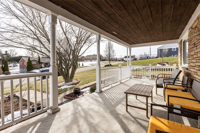 view of patio with a residential view and a porch