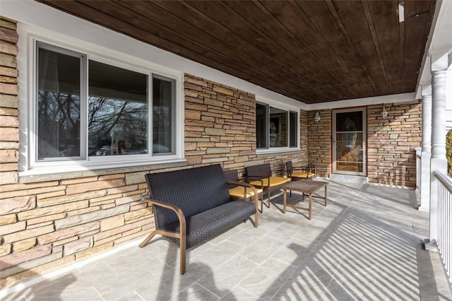 view of patio featuring a porch