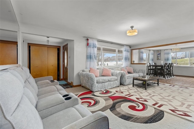 living room featuring baseboards and wood finished floors