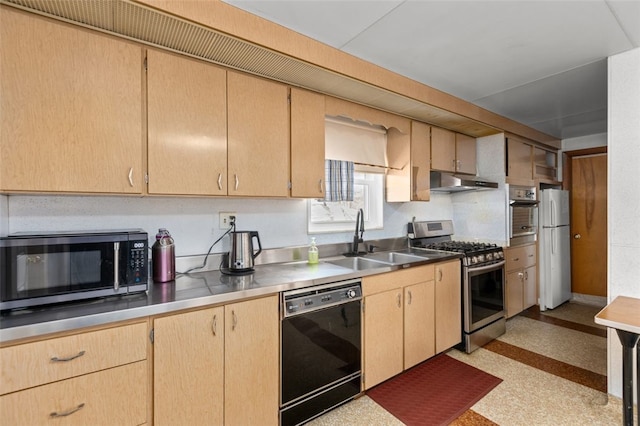 kitchen with under cabinet range hood, light brown cabinetry, appliances with stainless steel finishes, and a sink