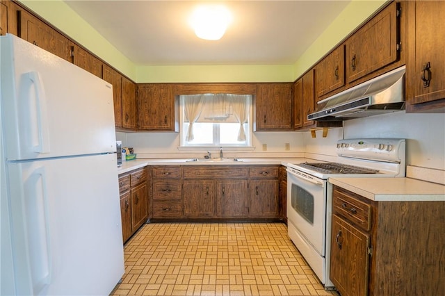 kitchen with sink and white appliances