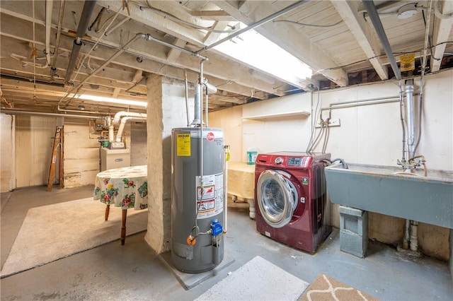 basement featuring sink, washer / dryer, and water heater