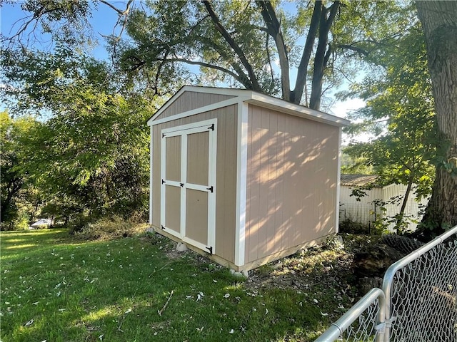 view of outdoor structure with a lawn