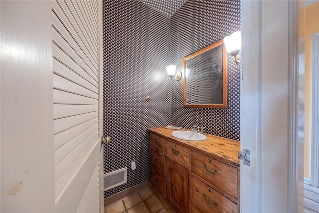 bathroom featuring tile patterned flooring and vanity