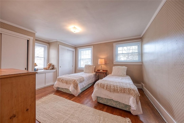 bedroom with hardwood / wood-style flooring and crown molding