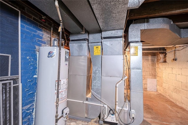 utility room featuring water heater