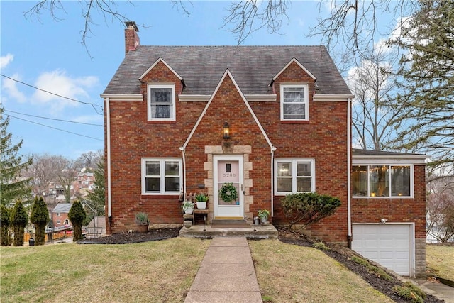 view of front of house with a garage and a front yard