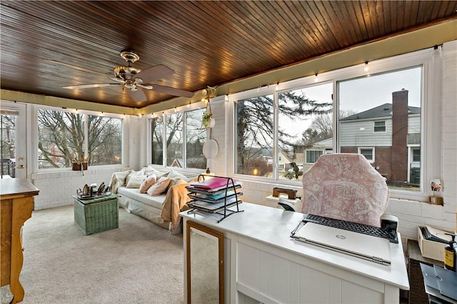 sunroom featuring wooden ceiling and ceiling fan