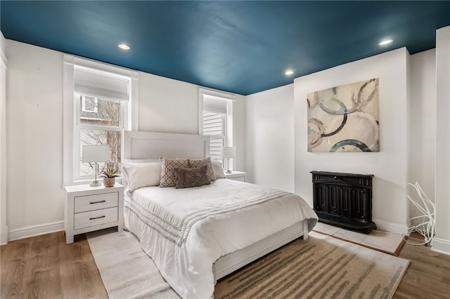 bedroom with light hardwood / wood-style flooring