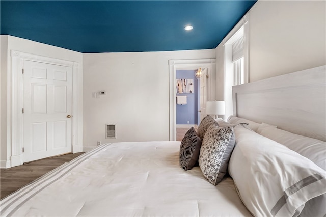 bedroom featuring wood-type flooring