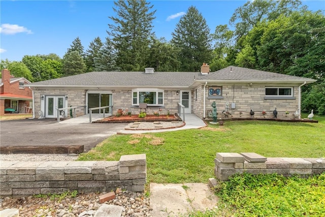 back of house featuring a yard and a patio area