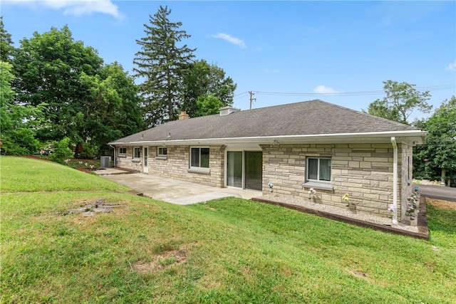 back of house featuring a yard and a patio