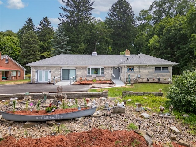 rear view of property with french doors