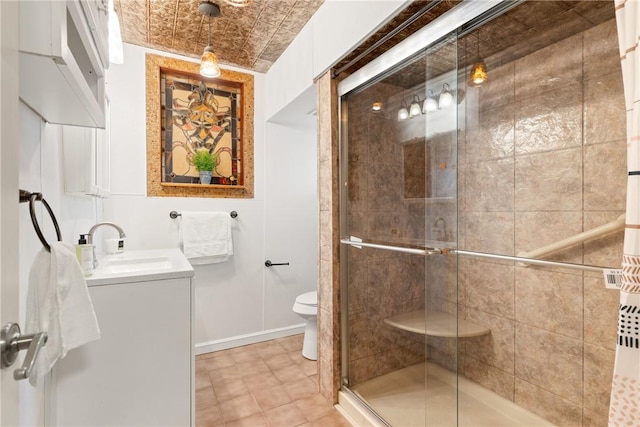 bathroom with vanity, an enclosed shower, and toilet