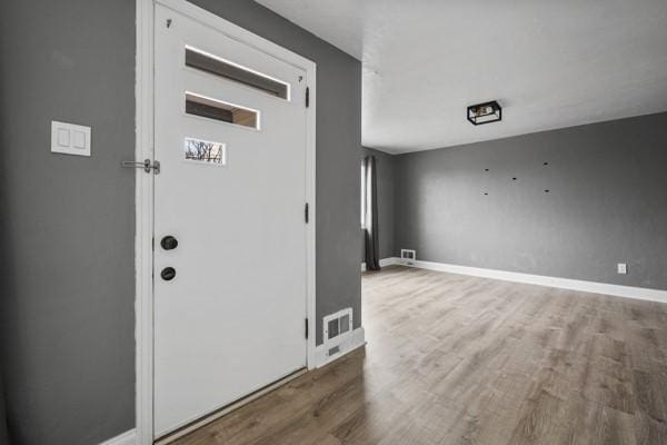 foyer entrance featuring hardwood / wood-style floors