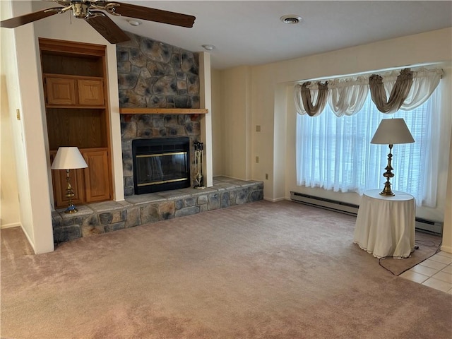 unfurnished living room featuring ceiling fan, a fireplace, vaulted ceiling, and light carpet