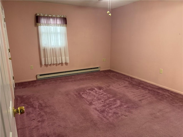 carpeted empty room with a baseboard radiator