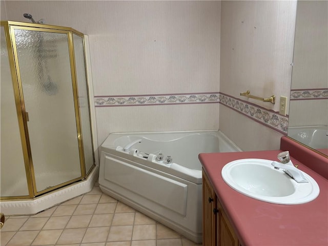 bathroom with tile patterned floors, vanity, and shower with separate bathtub