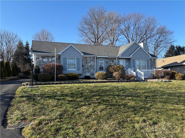 ranch-style home with a front yard