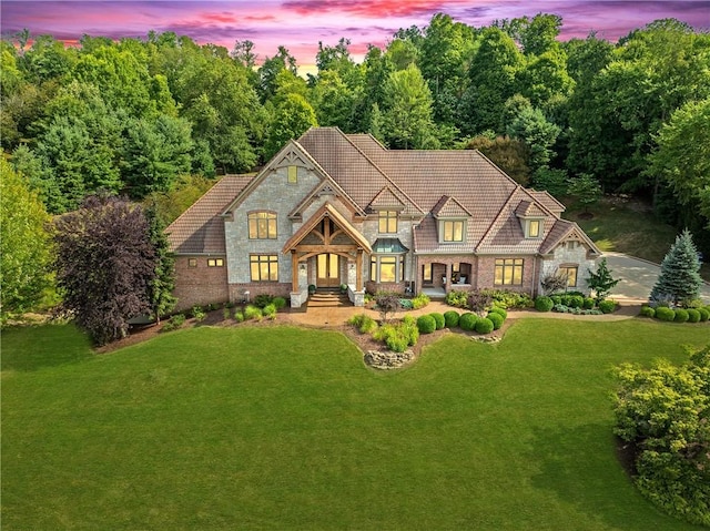 view of front of home with a lawn