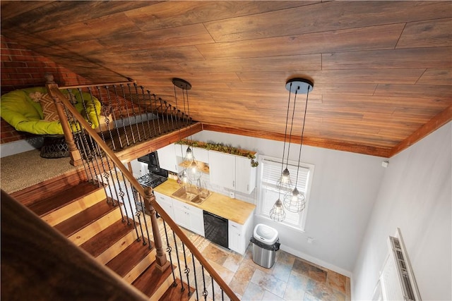 stairs with wood ceiling and vaulted ceiling