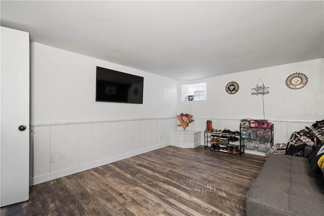 unfurnished living room with dark hardwood / wood-style flooring