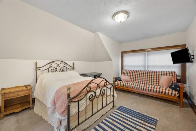 bedroom featuring light carpet