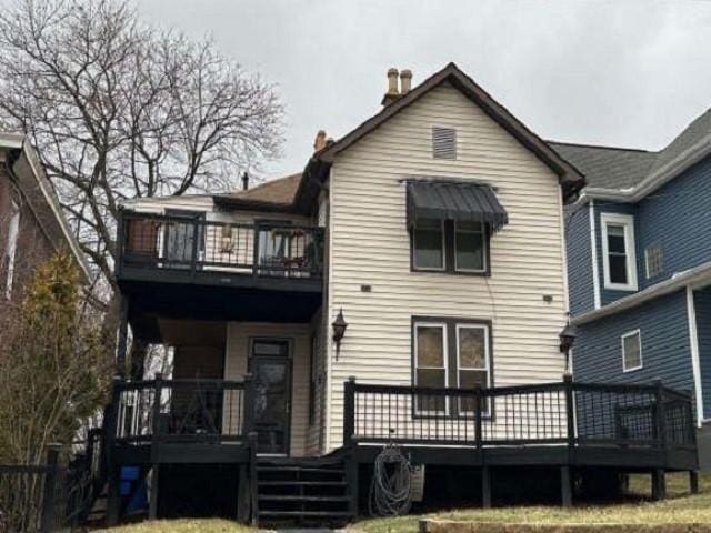 rear view of house with a deck