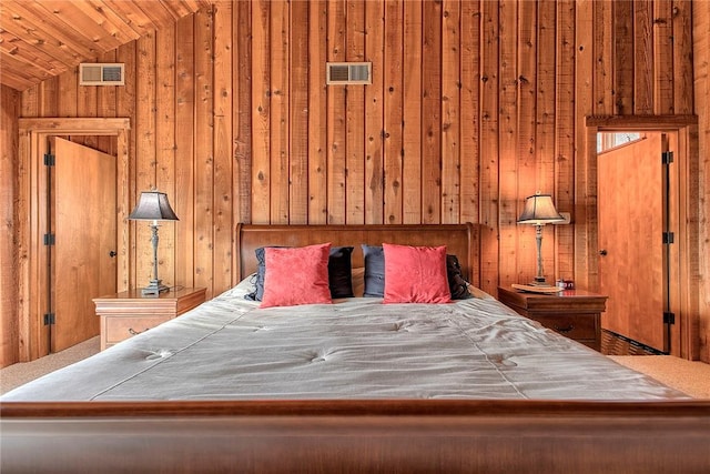 unfurnished bedroom featuring vaulted ceiling and wooden walls