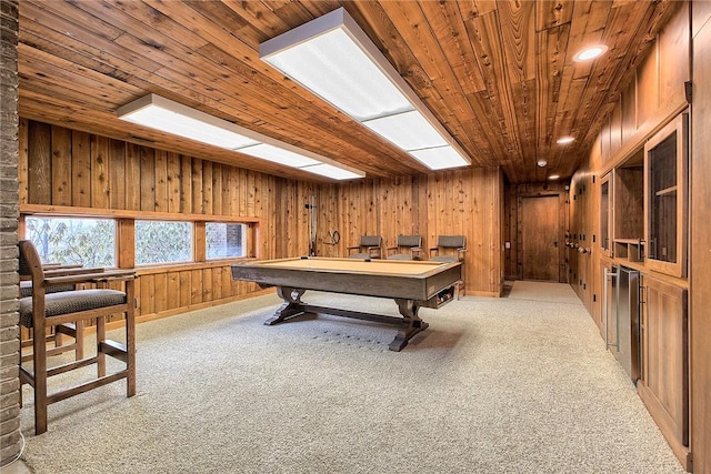 rec room with wood ceiling, billiards, wooden walls, and light carpet