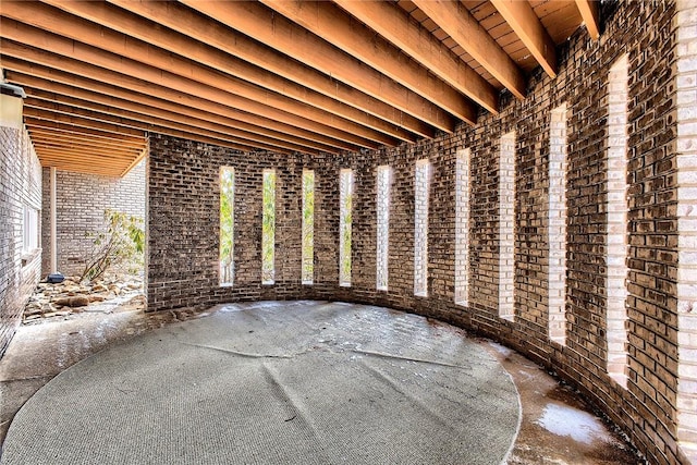 miscellaneous room with brick wall