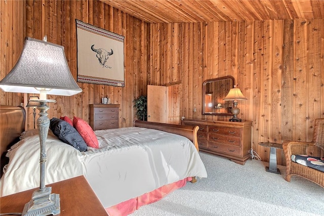 bedroom featuring carpet floors, wooden ceiling, and wood walls