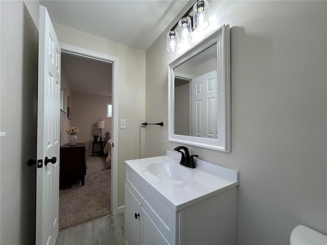 bathroom with vanity and hardwood / wood-style flooring